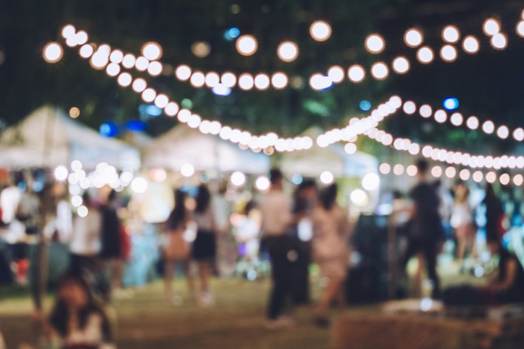 Festival Event Party with Hipster People Blurred Background Festival Event Party with Blurred Background - event photography tips