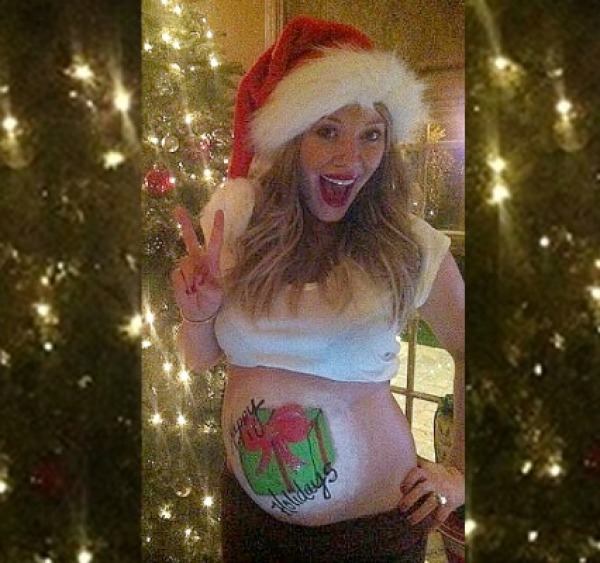 pregnant woman with a present painted on her belly